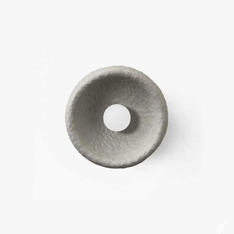 Japanese-style simple silent wall lamp with resin shade in three diameter sizes on white wall