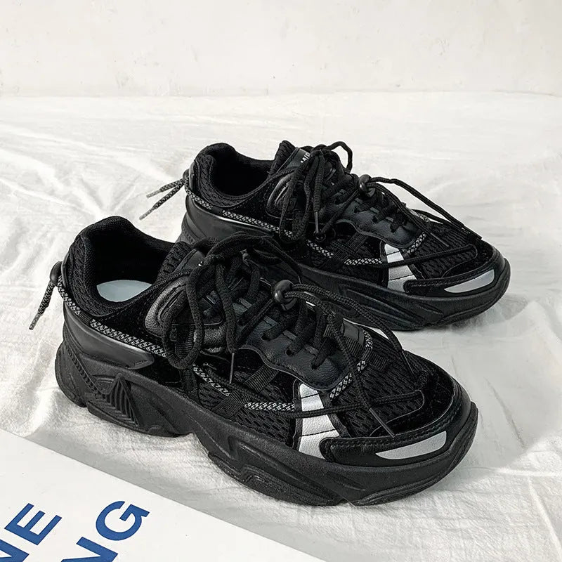 Men's platform dad shoes in black, white, or grey with a lace-up front and a thick sole.