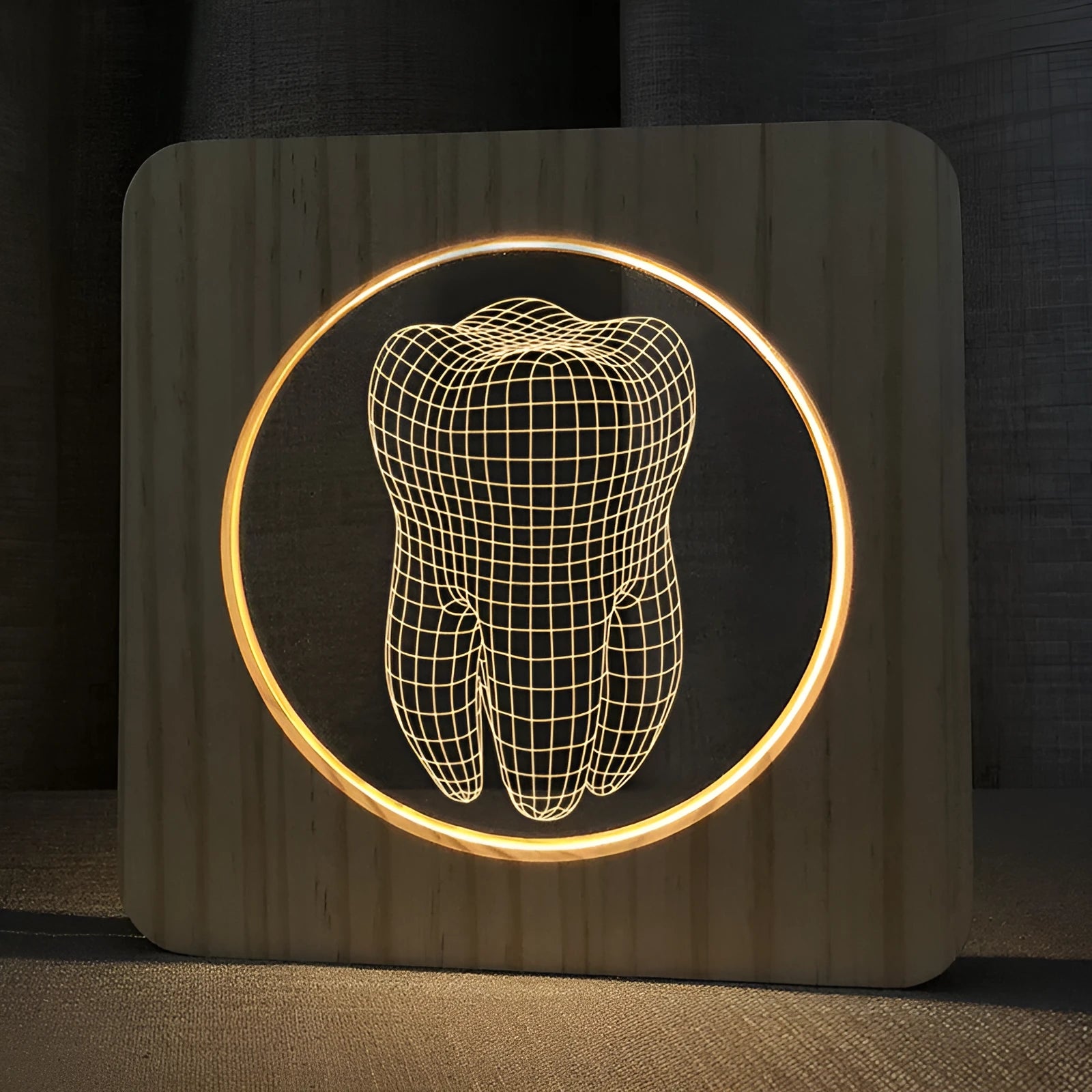 Tooth shaped wooden colour acrylic night lamp with USB cable on a table