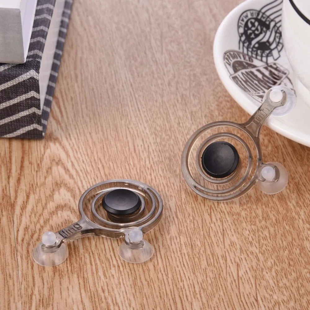 A pair of clear and black mini joysticks for mobile phone and tablet touch screens