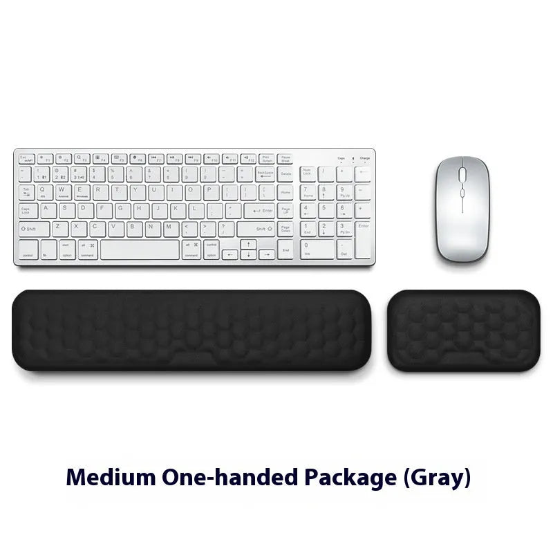 Memory foam mouse wrist rest pad with silicone base in black cloth cover option on desk