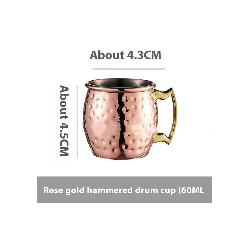 Copper plated stainless steel Moscow Mule mug in hammered and smooth styles, shown in silver, gold, rose gold, and black.