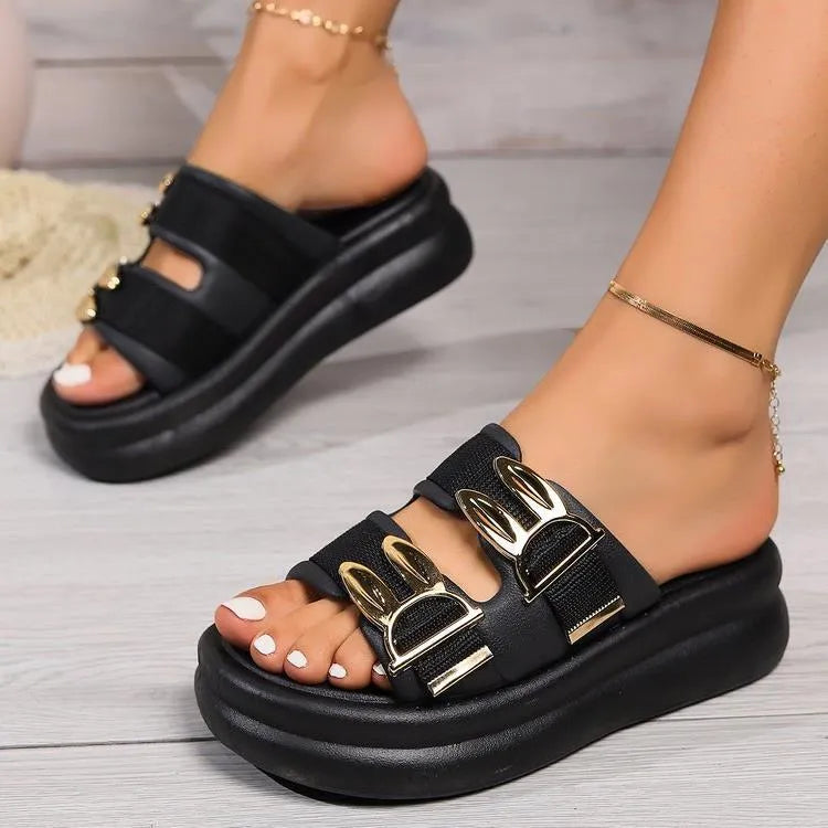 Women's apricot suede slippers with thick rubber sole on wooden floor