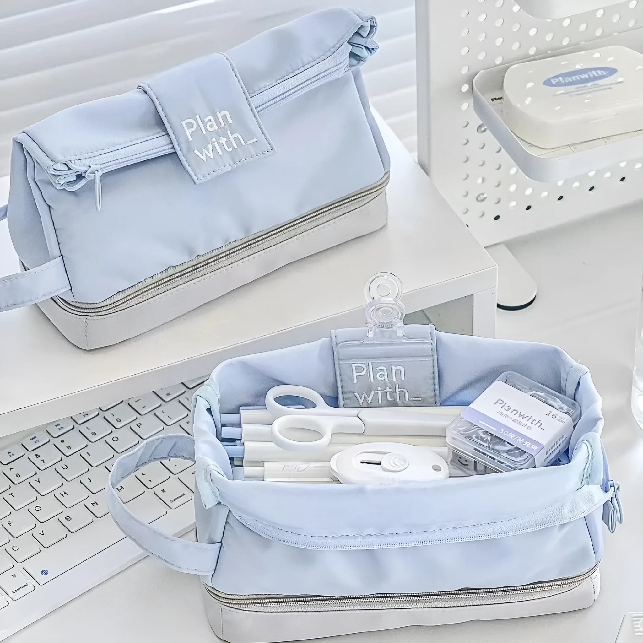 Dark blue double layer folding fabric pencil case open to show A4 layout with elastic pen slots.