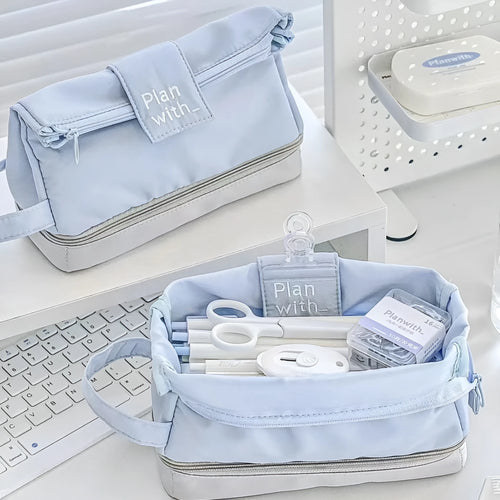 Dark blue double layer folding fabric pencil case open to show A4 layout with elastic pen slots.