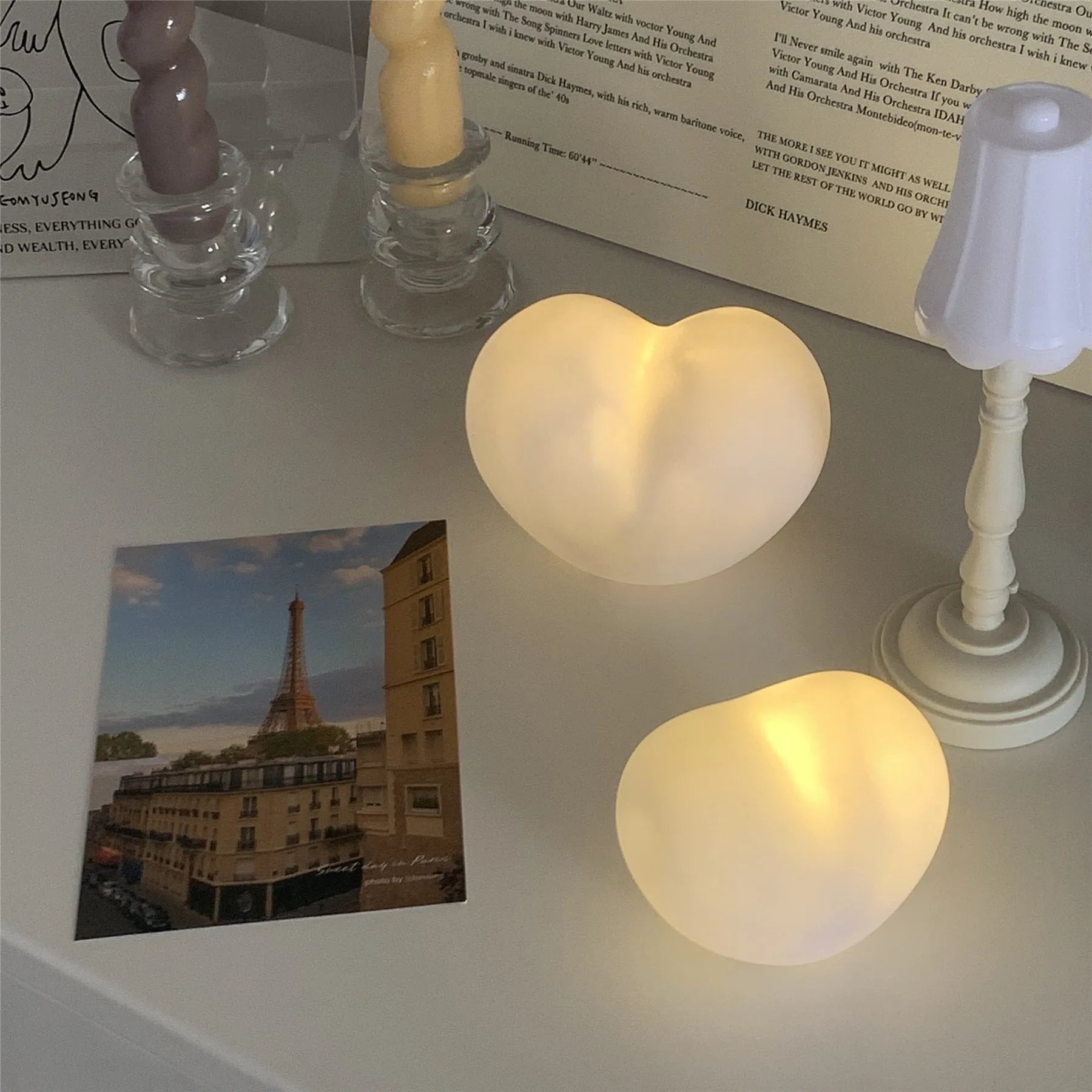 White or pink vinyl atmosphere lamp in trumpet or tuba design with warm glowing light