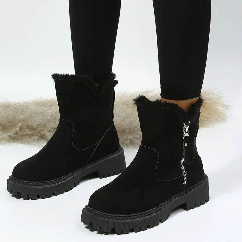 Women's black high-top snow boots with side zipper and thick plush lining on a winter background.