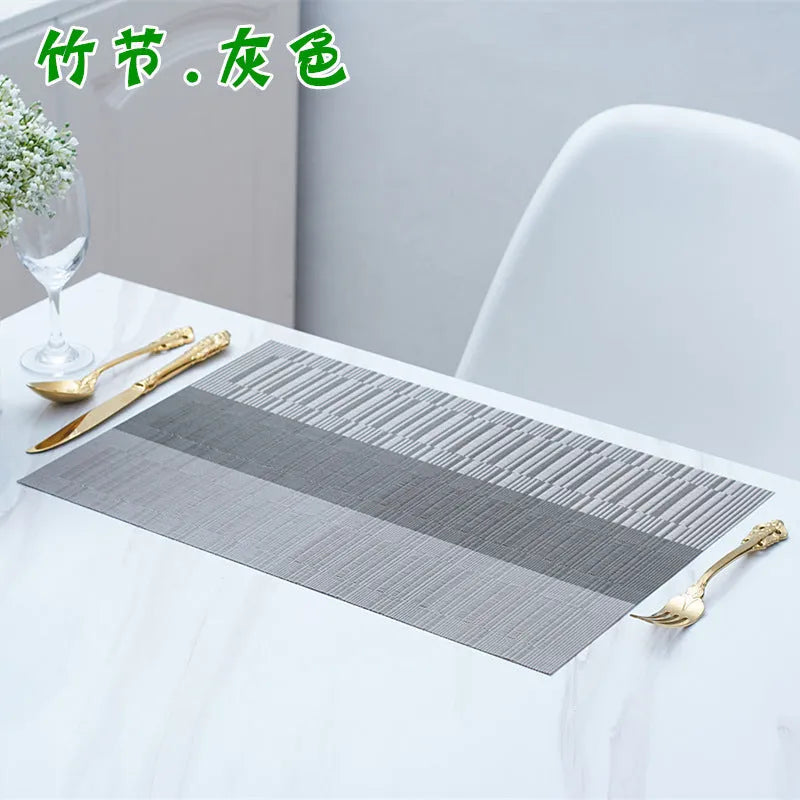 Non-slip PVC place mat in modern simple style, showing gradient bamboo black colour option on a kitchen counter.
