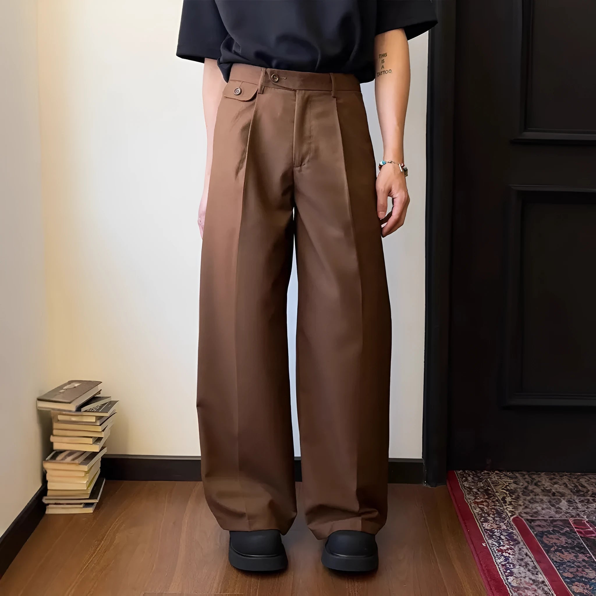 Man wearing straight-leg loose fit casual trousers in brown, showcasing the drape and fit.