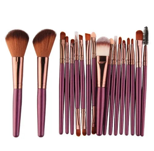 MAANGE 18-piece makeup brush set with fan-shaped cosmetic tools laid out on a table.
