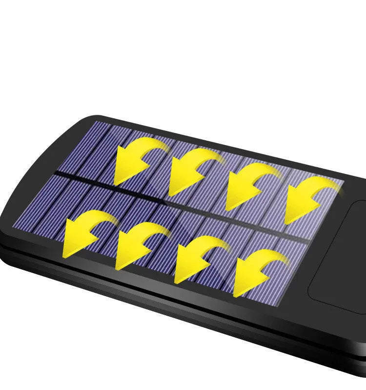 Black solar-powered outdoor motion sensor light mounted on a wall or post.
