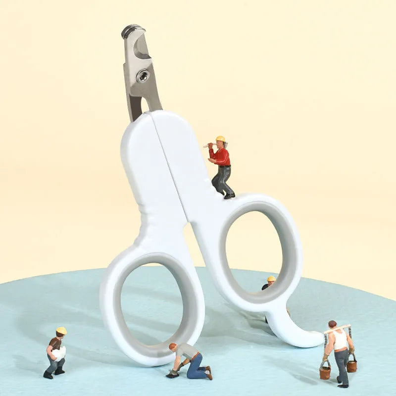 Professional pet nail clippers with curved safety tips and a grey non-slip rubber handle.