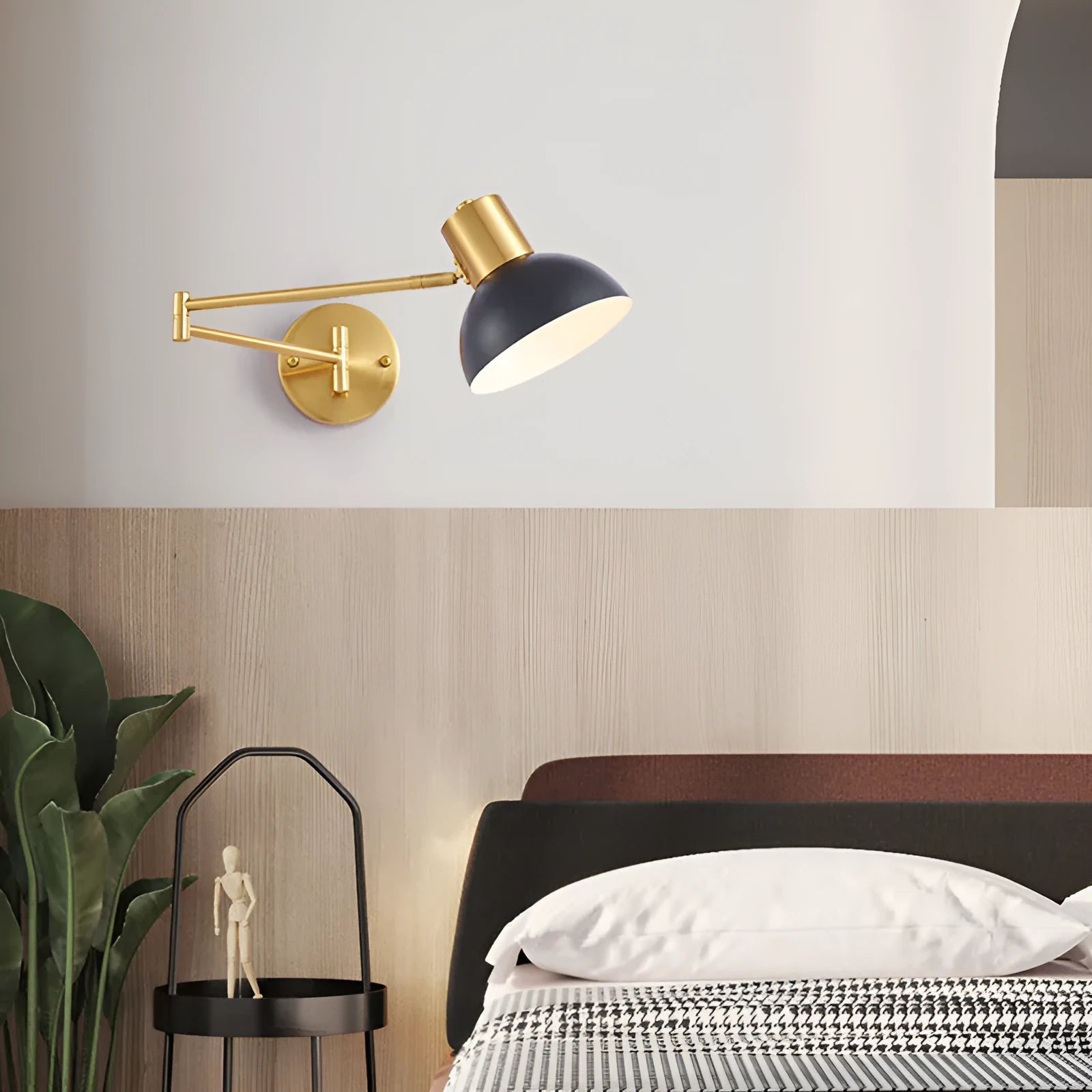 Modern double-section rocker arm wall lamp with adjustable arms on a white wall.
