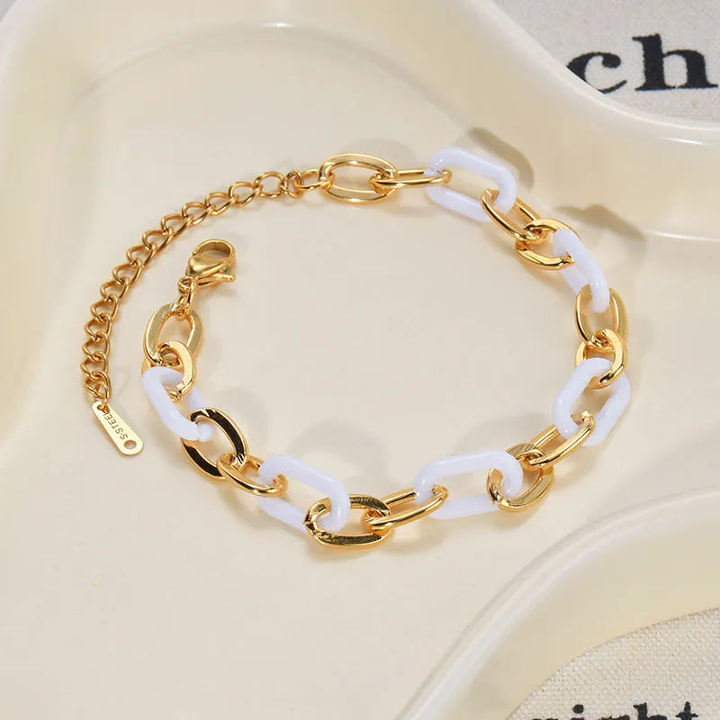Ins style stainless steel and resin bracelet with a double-layered heart charm.