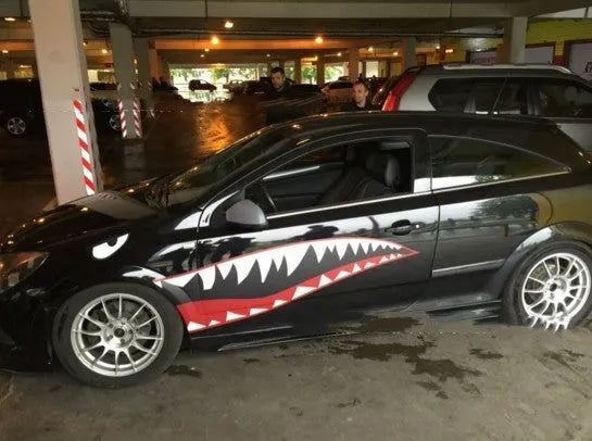 Large shark design car body sticker vinyl decal shown on a vehicle door.