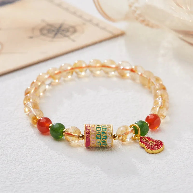 Hand-woven citrine five sutra bracelet with 6mm crystal beads on wrist