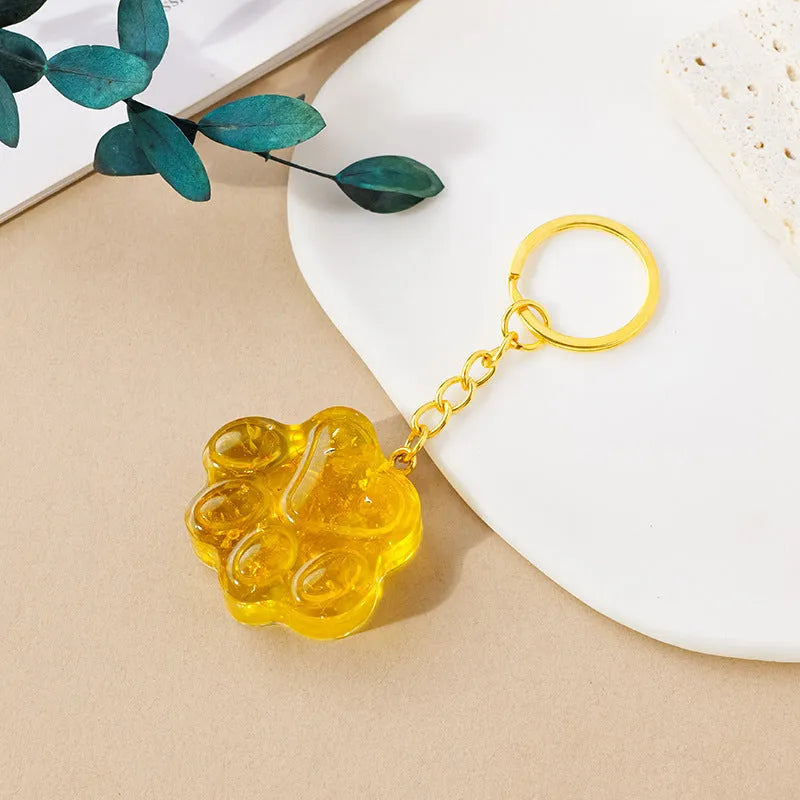 Natural crystal cat's paw keychain pendant charm in one of ten crystal types including pink crystal and amethyst.