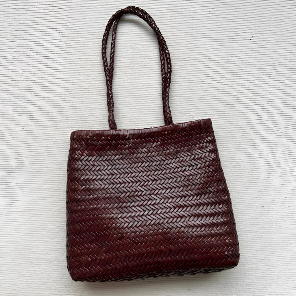 Brown handmade woven leather tote bag with outer pocket