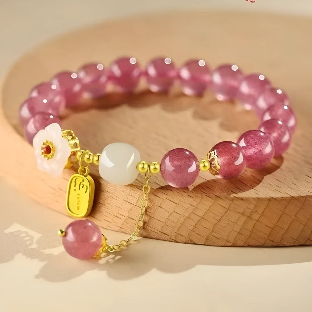 Handmade natural strawberry quartz crystal bracelet for women with moon and pearl bead designs.