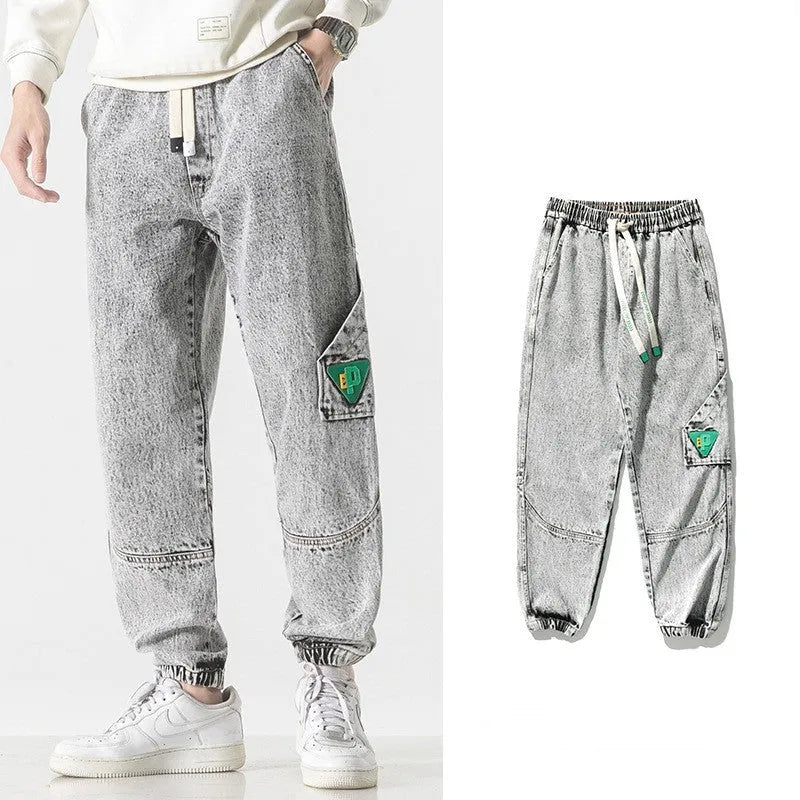 Men's loose-fit tapered cotton trousers in black, blue and grey colours showing mid-waist design