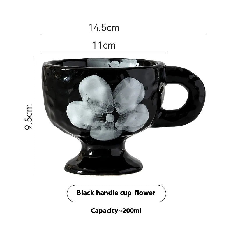 Hand-pinched irregular ceramic mug with modern minimalist design in solid colour