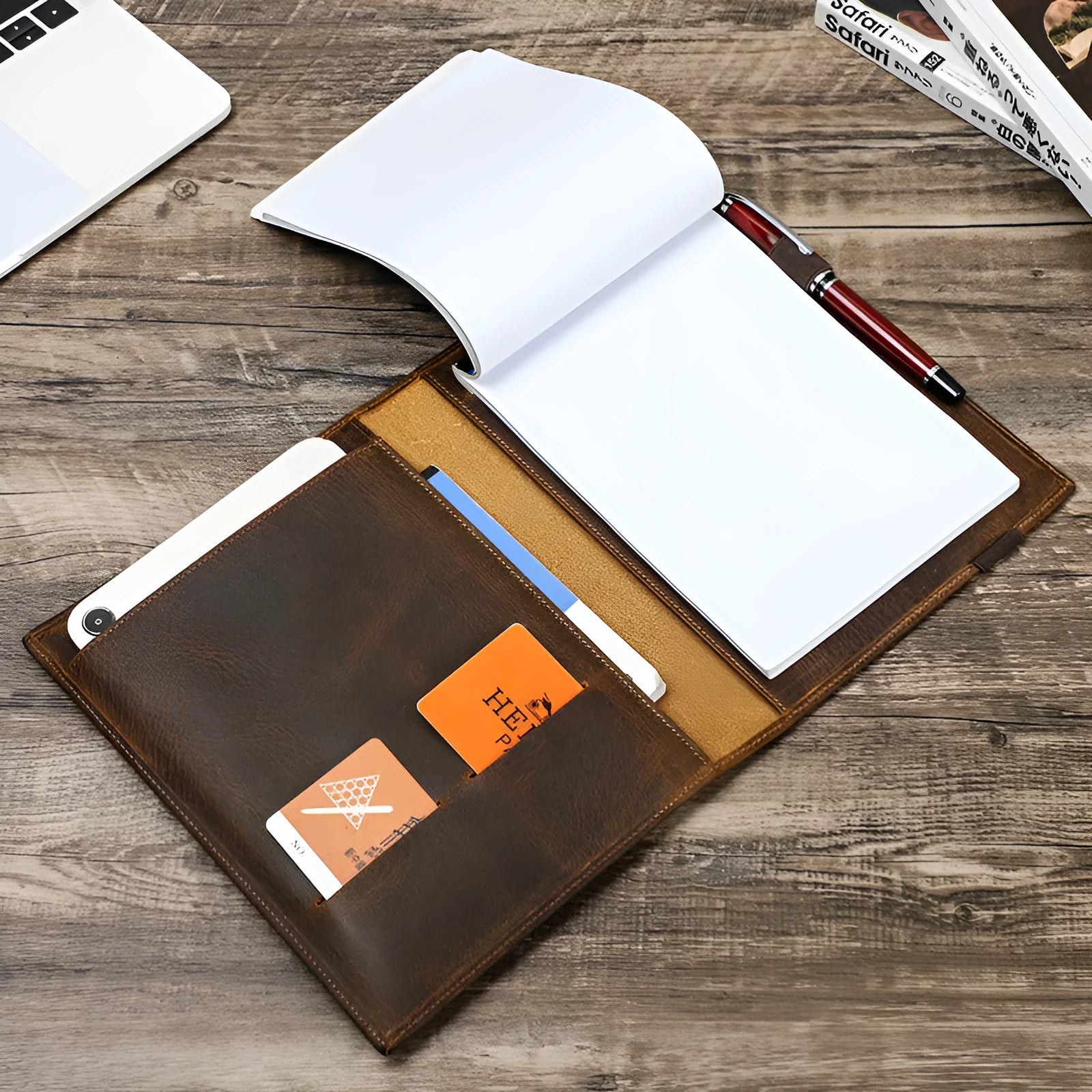 Brown Crazy Horse leather protective sleeve for an A5 notebook, showing square shape and multi-pocket design.