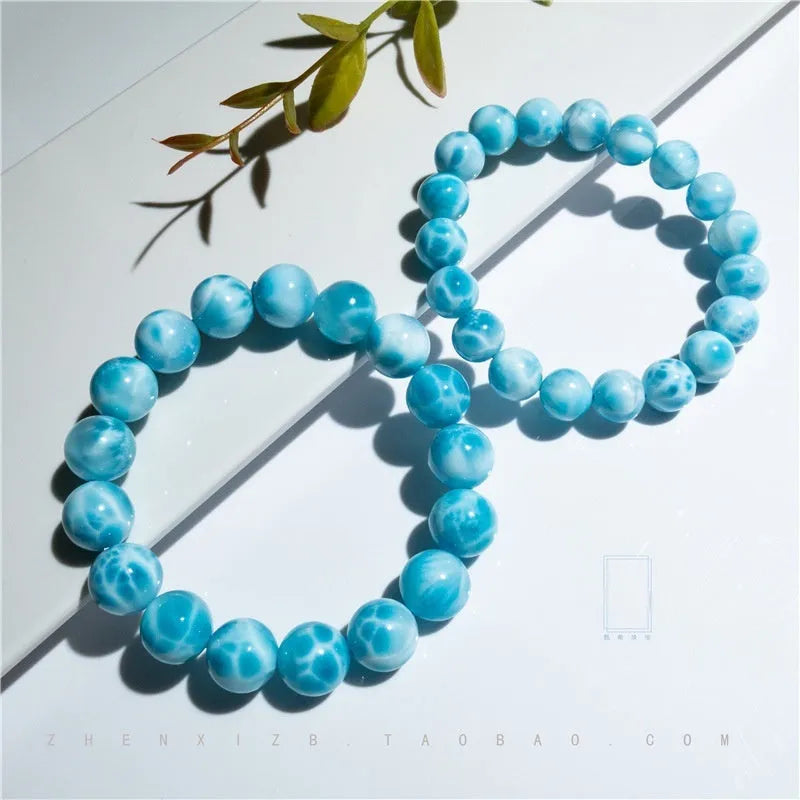 Blue Bodhi bracelet with sea-pattern crystal beads and pearl accents in Maillard style on wrist