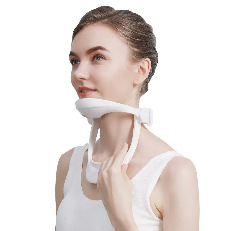 White PP plastic neck and shoulder support brace for posture correction on a grey background.