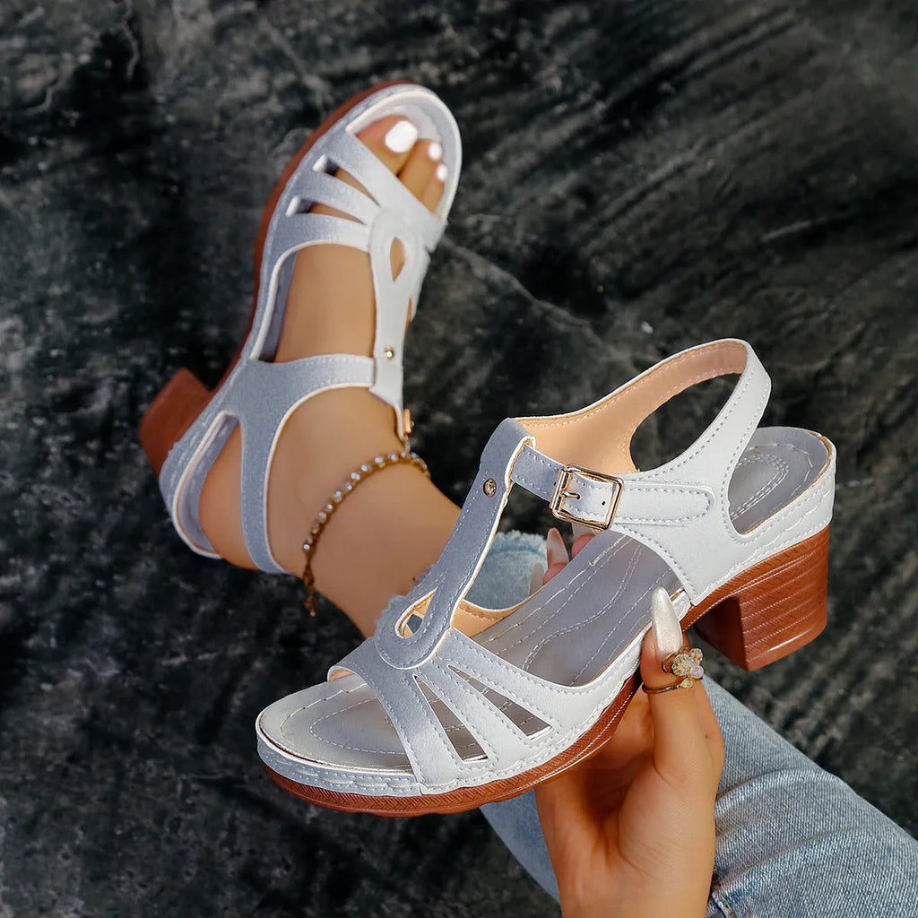 Women's black peep toe wedge sandals with a buckle fastening and platform sole.