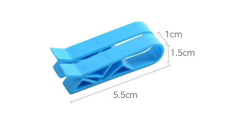 White PP plastic garbage bag fixing clip holding a black bin liner to a trash can rim.
