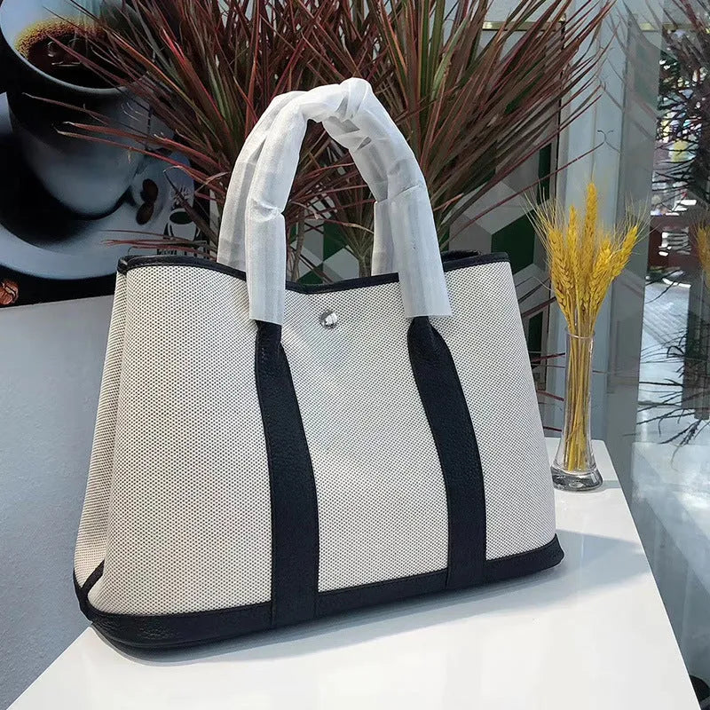 Genuine leather crossbody bucket tote bag with canvas surface in multiple colour options