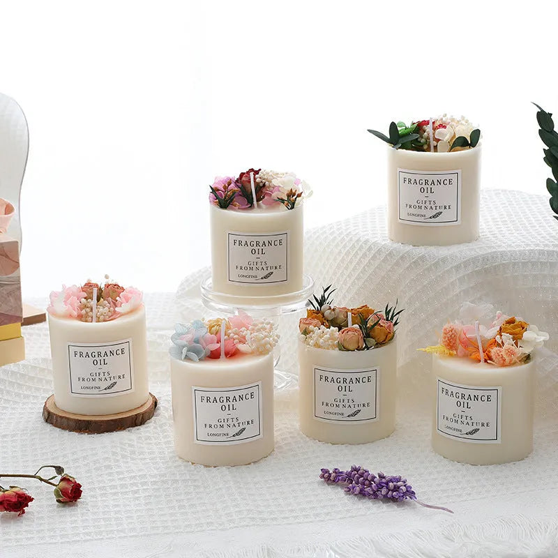Decorative dried flower scented candle in gift box with wooden base, showing embedded botanicals.