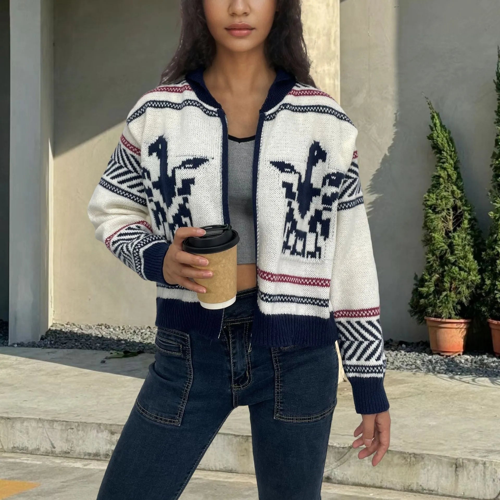 White women's cardigan with a front zip, lapel collar, and jacquard contrast colour striping.
