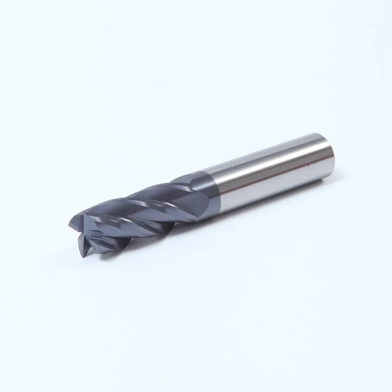 Carbide spiral flute milling cutter with straight shank on a grey background.