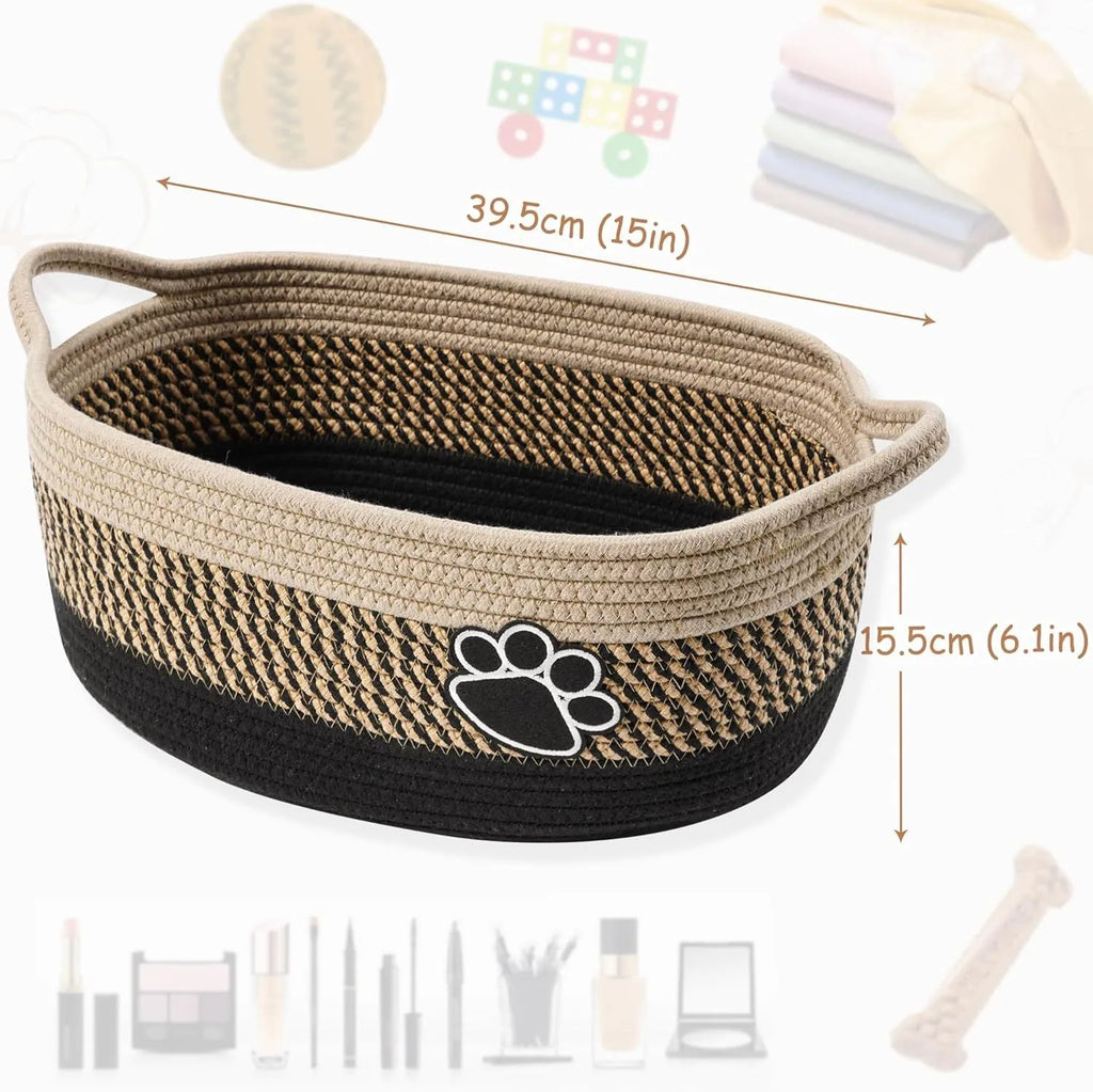Light beige handmade cotton rope storage basket with handle, shown with toys inside.