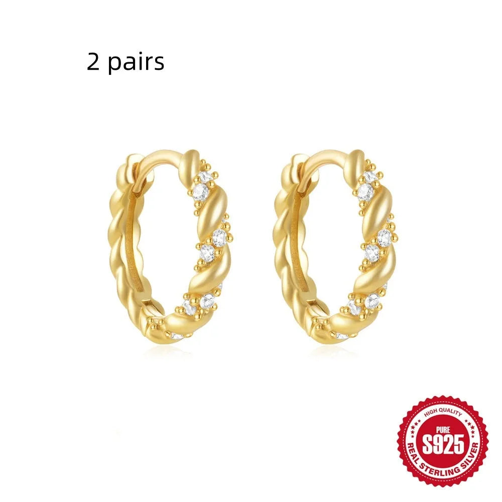 Sterling silver geometric stud earrings with small round diamond accents in gold or silver electroplated finish