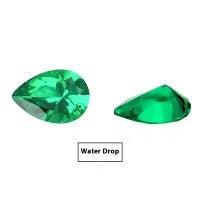 Cultivated emerald gemstone in Columbian green colour showing various polished cuts on a white background.