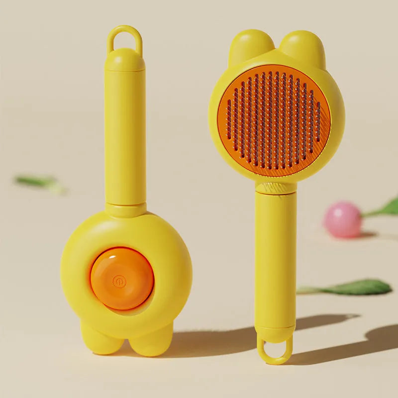 Self-cleaning pet grooming brush with green handle and stainless steel comb, showing the one-click release button.