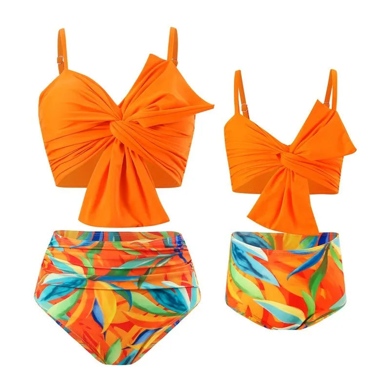 Women's big bow bikini print swim trunks set in orange with nylon fabric, front view