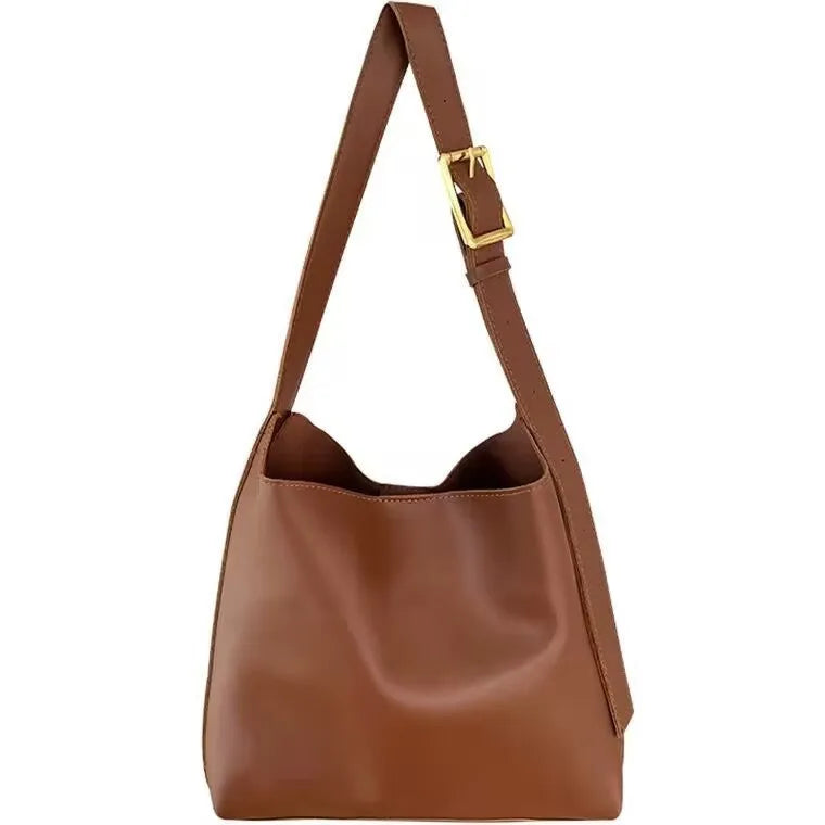Women's soft PU leather shoulder bag with decorative threads measuring 28x32x12cm in black and brown colour options