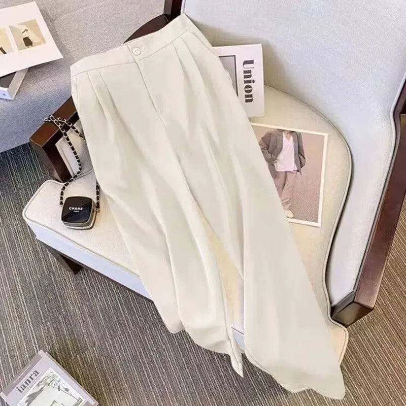 Women's loose fit polyester top and pants set in khaki colour on a hanger