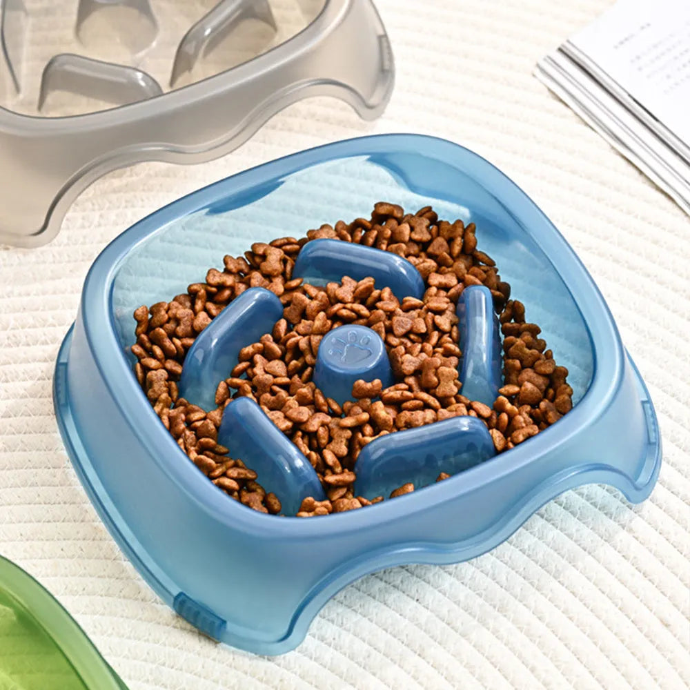 Blue plastic dog slow feeder bowl with anti-choking design on white background