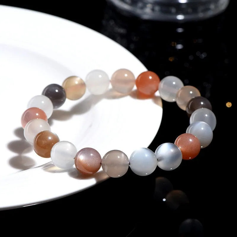 Natural moonstone colourful moonlight bracelet with 8mm beads in a single circle on a wrist.