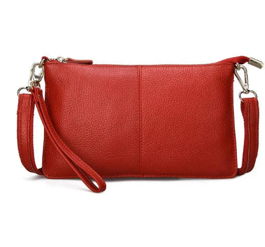Structured cowhide leather lady slant bag showing front zipper compartment and dual strap options