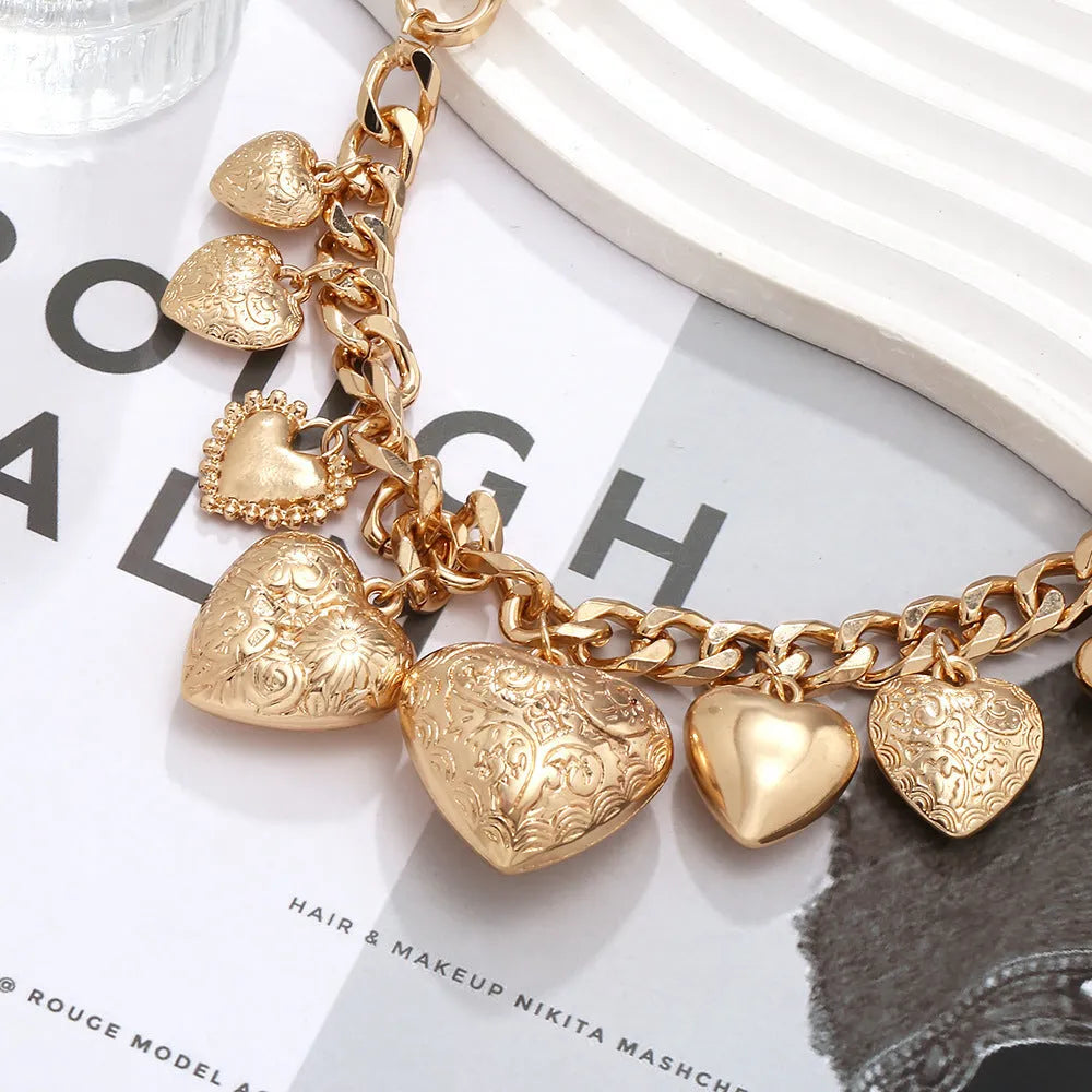 Women's gold carved heart pendant necklace on metal chain with adjustable 41-50cm length