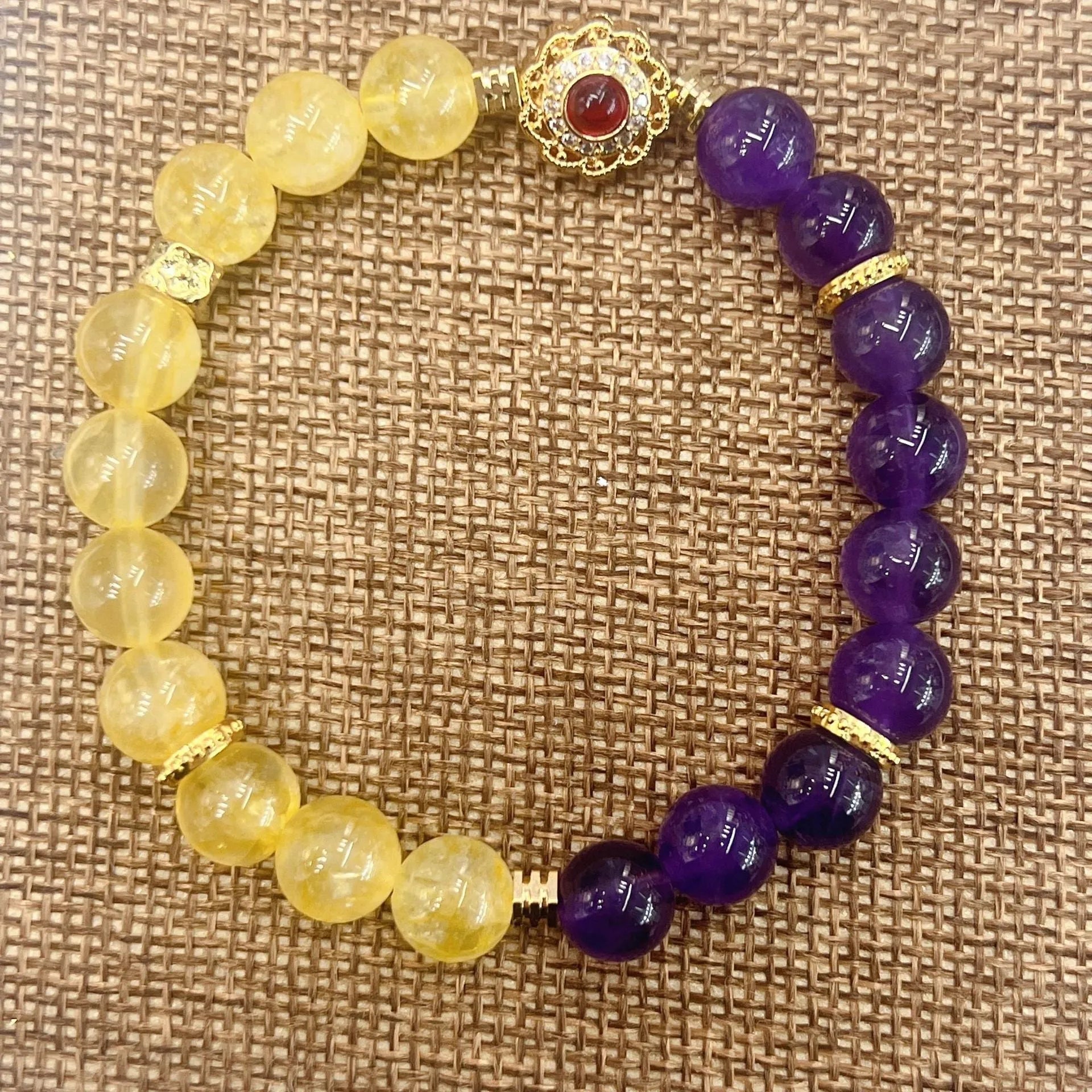 Handmade women's yellow and purple amethyst crystal bracelet with secure clasp fastening