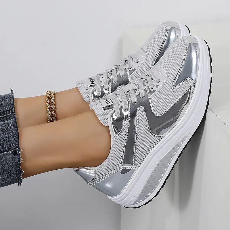 Women's gold platform trainers with mesh upper, cross-strap design and waterproof platform