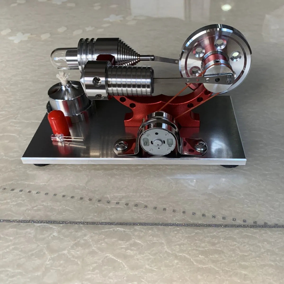 2019 Red upgrade miniature Stirling engine toy on a desk, 155x80x85mm, showing flywheel and cylinder