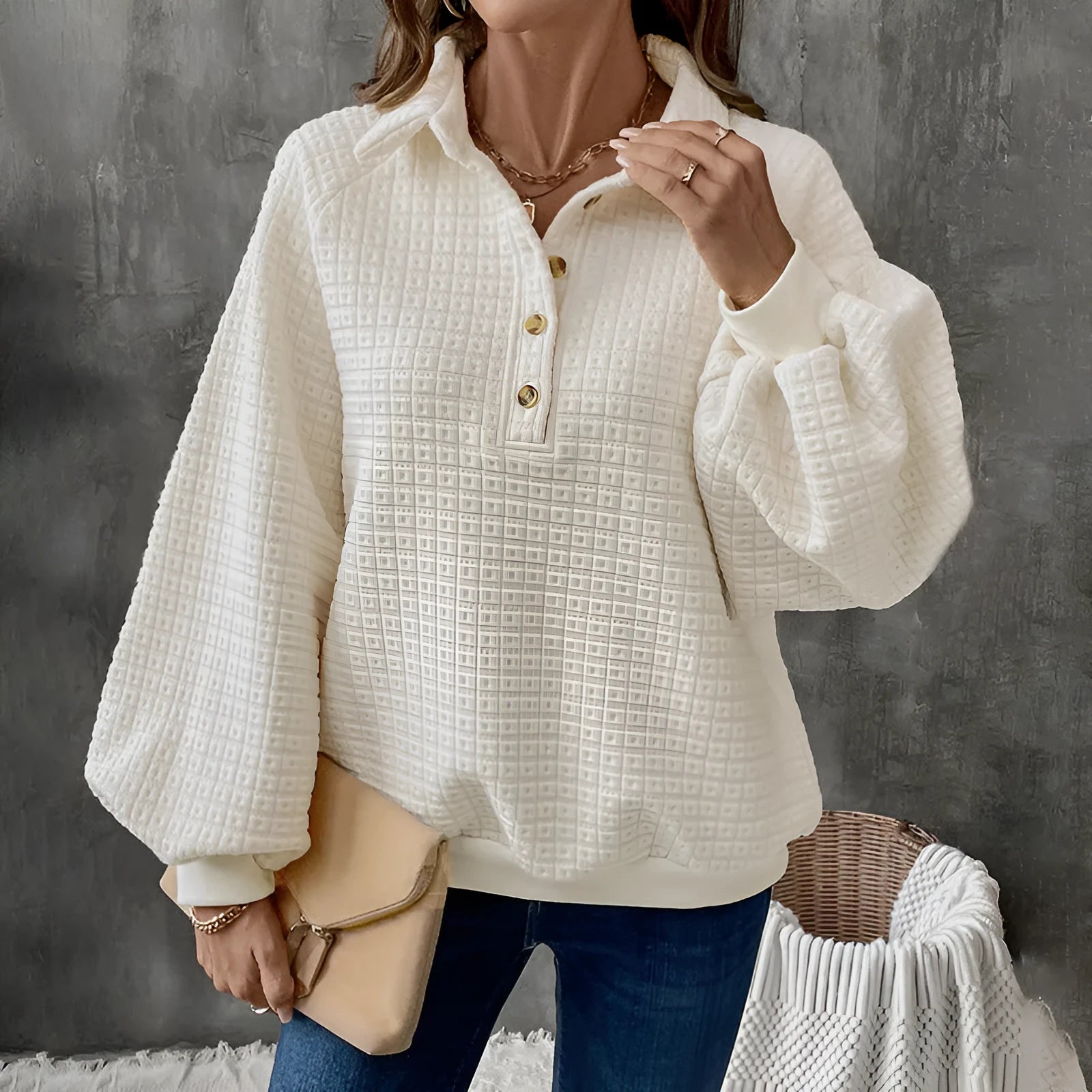 Women's beige texture polo collar solid colour pullover sweater on a hanger.