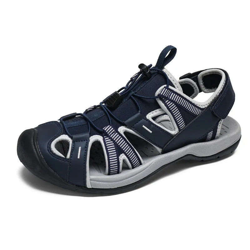 Men's blue mesh velcro sports shoe with rubber sole and toe holder design on a white background